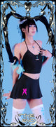 Person in black outfit with decorative elements on a blue background