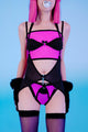 Person wearing a black and purple lingerie set with fur accents on a blue background