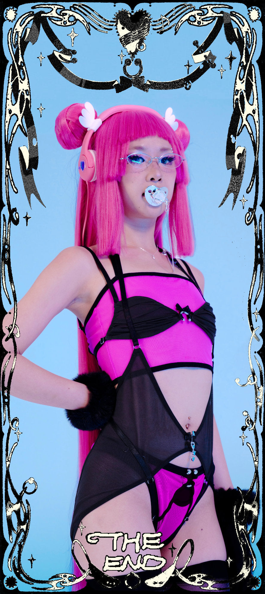 Person with pink hair and black and pink outfit against a blue background